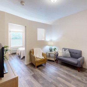 a living room with a tv and couches